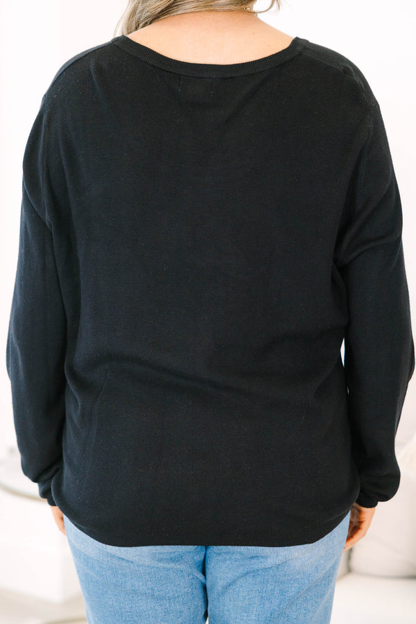 Plus Size black long sleeve sweater with a crew neckline and relaxed fit in a soft knit fabric.