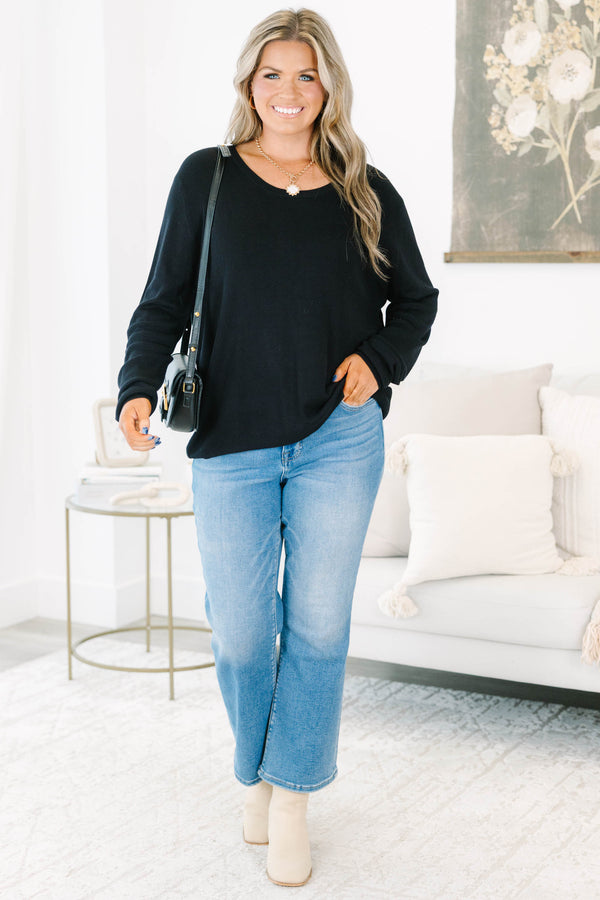 Plus Size black long sleeve sweater with a crew neckline and relaxed fit in a soft knit fabric.