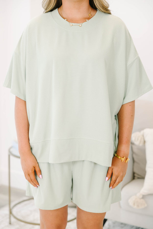 Plus Size sage green two-piece set with a short-sleeve ribbed top and matching pull-on shorts.