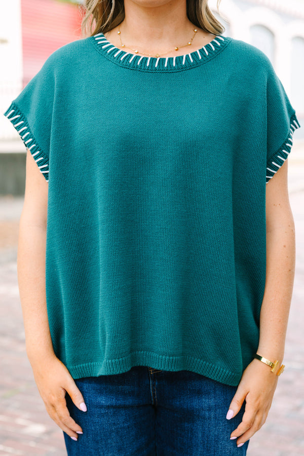 Plus Size hunter green cap sleeve knit top with white blanket stitching on the neckline and arms.