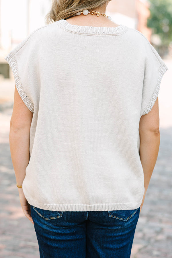 Plus Size sand beige short sleeve knit top with a round neckline and ribbed trim details.