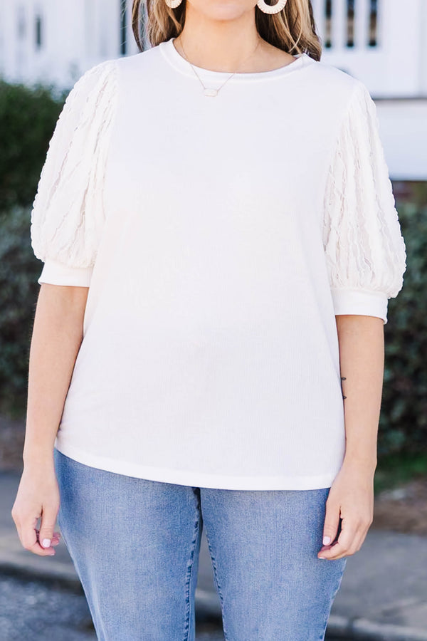 Plus Size off white top with a round neckline and textured mesh bubble sleeves.