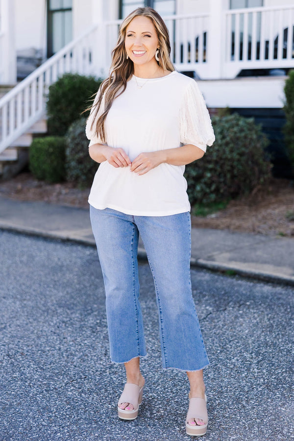 Plus Size off white top with a round neckline and textured mesh bubble sleeves.