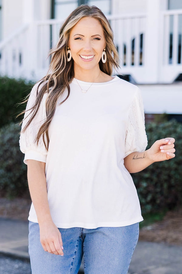 Plus Size off white top with a round neckline and textured mesh bubble sleeves.
