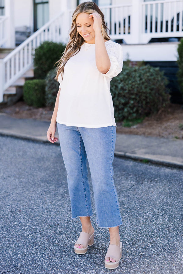Plus Size off white top with a round neckline and textured mesh bubble sleeves.
