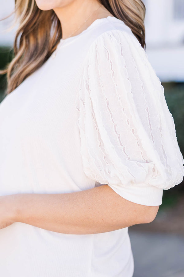 Plus Size off white top with a round neckline and textured mesh bubble sleeves.