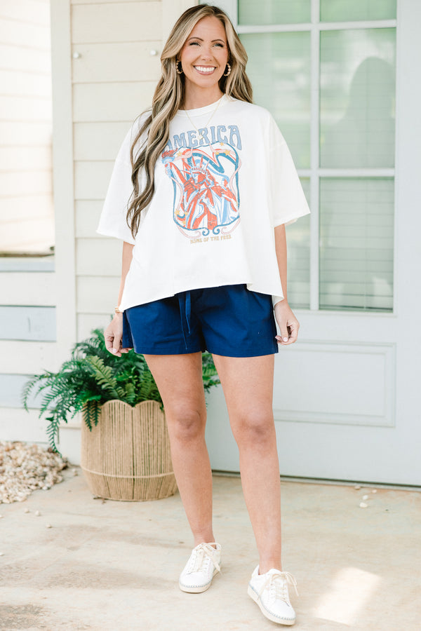 Chic Soul plus size clothing, short-sleeve white drop shoulder vintage washed tee with a high-scoop-neckline and a washed red white and blue graphic with lettering stating 