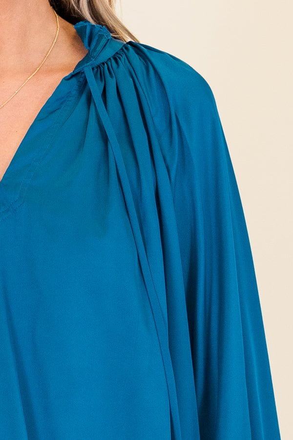 Chic Soul plus size clothing, long-sleeve v-neckline blue blouse with smocked detailing on wristline and neckline with tassels 