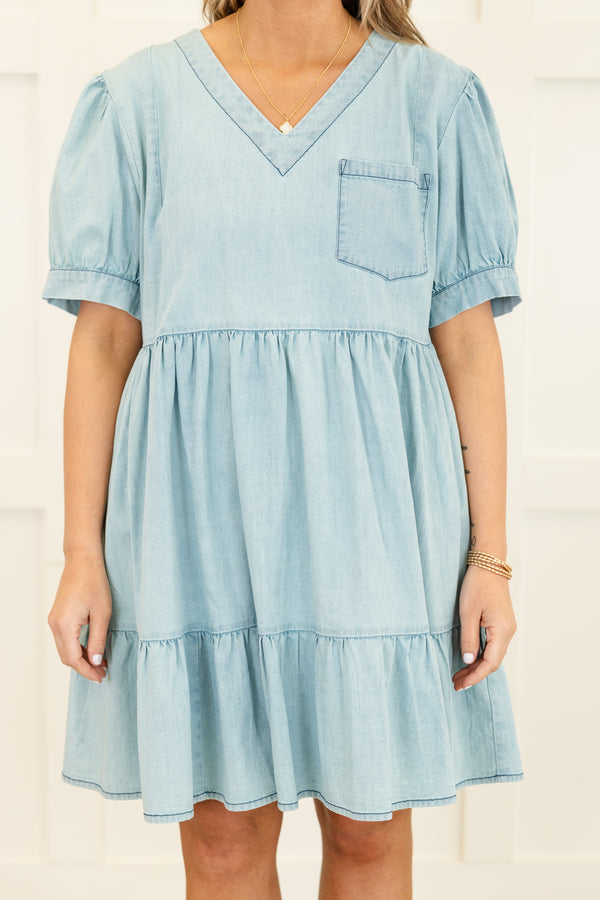 Chic Soul plus size clothing, short-puffed-sleeve blue light wash denim ruffled baby doll dress with a v-neckline and a pocket on the bodice 