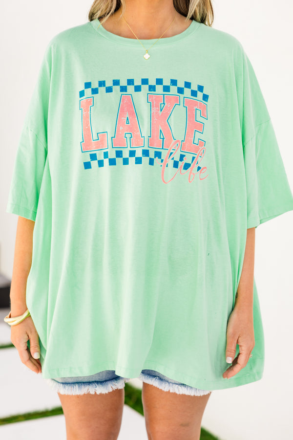 Chic Soul plus size clothing, short-sleeve green mint boyfriend tee with a high-scoop-neckline and a blue checkered graphic print with pink lettering stating 