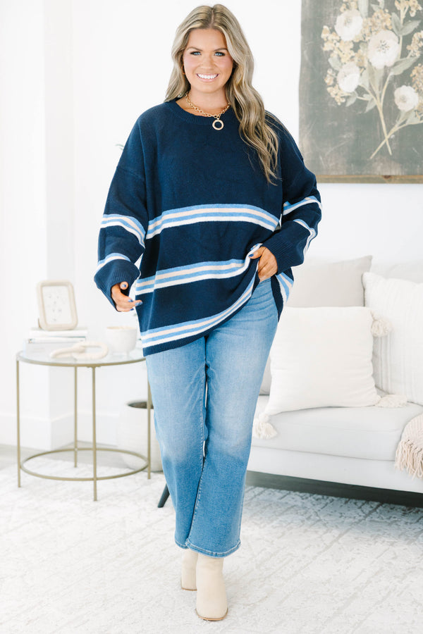 Plus Size navy blue crewneck sweater with horizontal light blue and white stripes and long sleeves.