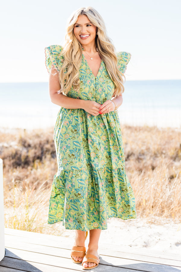 Chic Soul plus size clothing, short-flutter-sleeve green midi dress with a smocked bodice and a tiered skirt with a buttoned detailing down the front and a pink ric rac piping with a green tropical floral print pattern