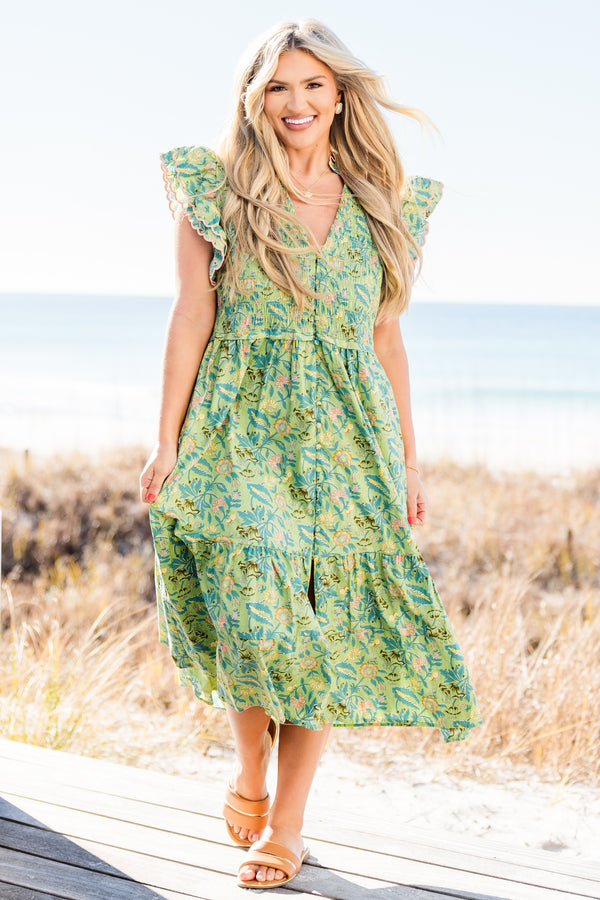 Chic Soul plus size clothing, short-flutter-sleeve green midi dress with a smocked bodice and a tiered skirt with a buttoned detailing down the front and a pink ric rac piping with a green tropical floral print pattern