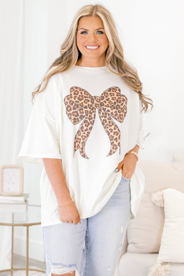 Chic Soul plus size clothing, ivory short sleeve graphic tee with a brown leopard bow graphic on the center of the tee 