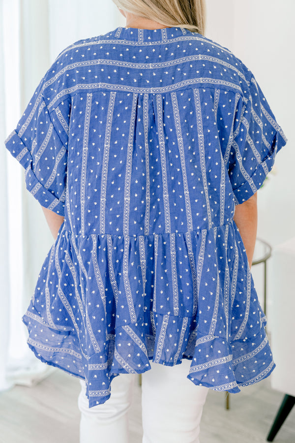 Chic Soul plus size clothing,  blue short sleeve flowy top with a polka dot and striped pattern as well as a ruffle detail at the bottom of the shirt 

