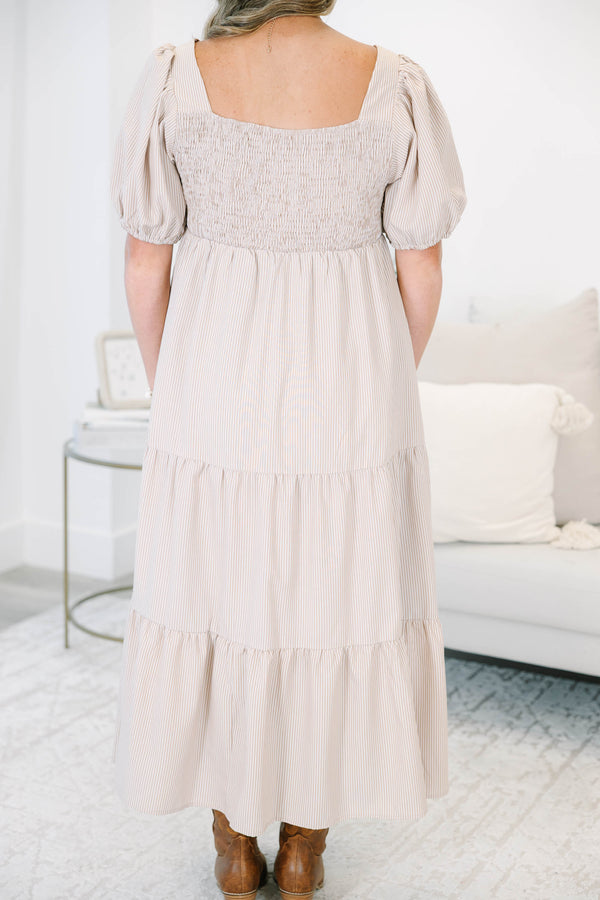 Plus Size ivory striped tiered maxi dress with a square neckline and puff sleeves.