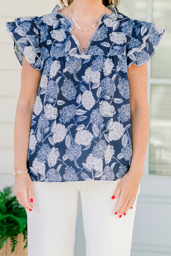   Chic soul plus size clothing, navy and white top with a hydrangea pattern and flutter sleeves 
