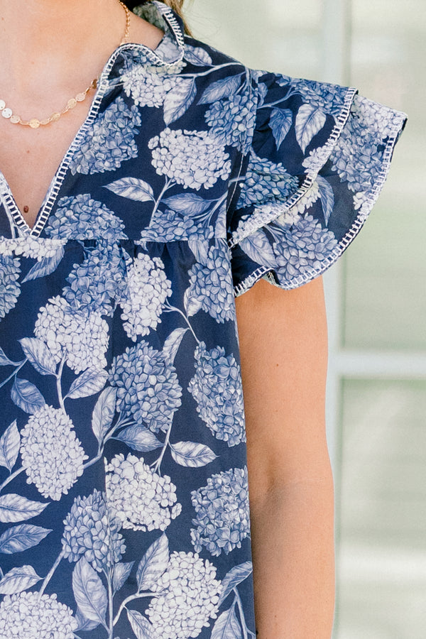   Chic soul plus size clothing, navy and white top with a hydrangea pattern and flutter sleeves 
