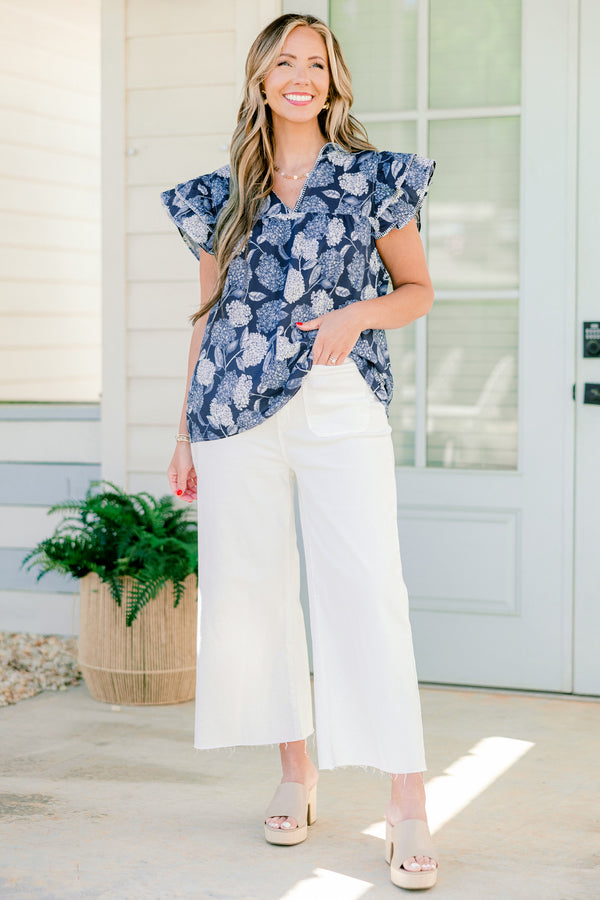   Chic soul plus size clothing, navy and white top with a hydrangea pattern and flutter sleeves 
