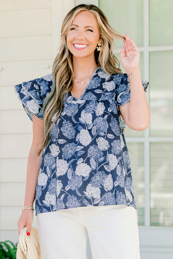   Chic soul plus size clothing, navy and white top with a hydrangea pattern and flutter sleeves 
