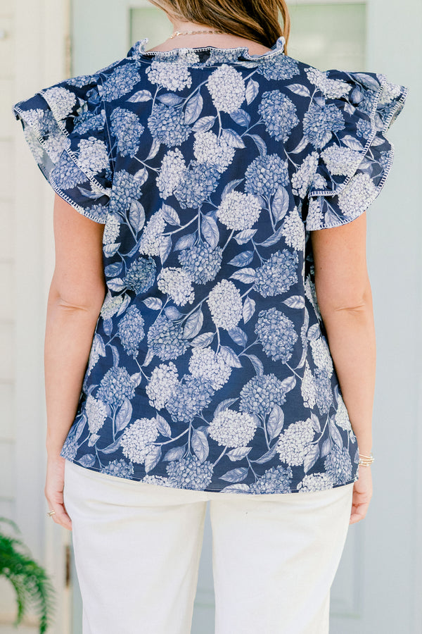   Chic soul plus size clothing, navy and white top with a hydrangea pattern and flutter sleeves 
