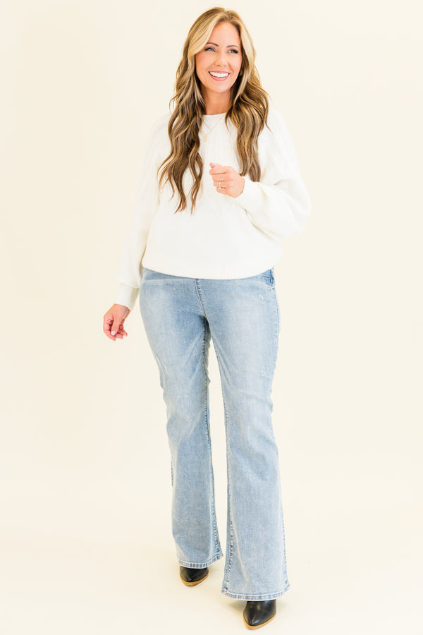 Chic Soul plus size clothing, high-waisted buttonless pull-on flare light wash jeggings with stitching along the middle and back pockets