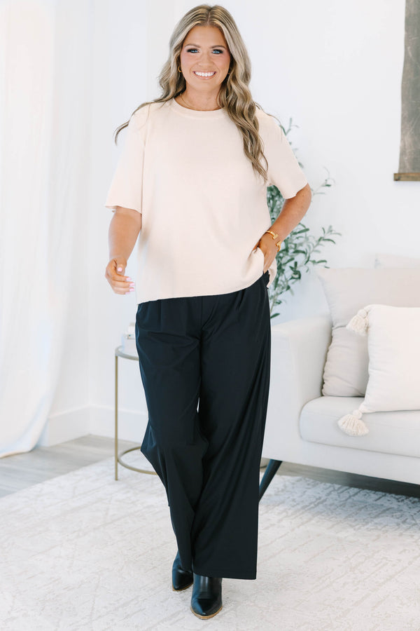 Plus size black wide-leg pants with a flowy fit and comfortable elastic waistband.