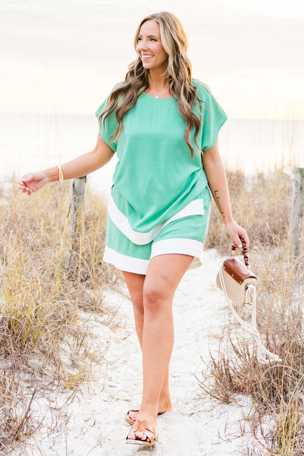 Chic Soul plus size clothing, aqua flowy shorts with stretchy waistband and drawstring detail with white string and white band along the bottom