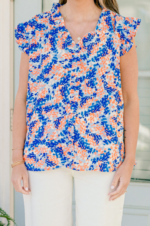 Chic Soul plus size clothing, blue/orange short sleeve abstract dot print blouse with ruffle on sleeves with v neckline and ruffle along center
