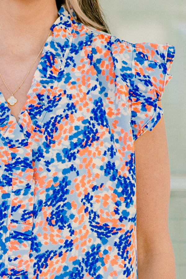 Chic Soul plus size clothing, blue/orange short sleeve abstract dot print blouse with ruffle on sleeves with v neckline and ruffle along center
