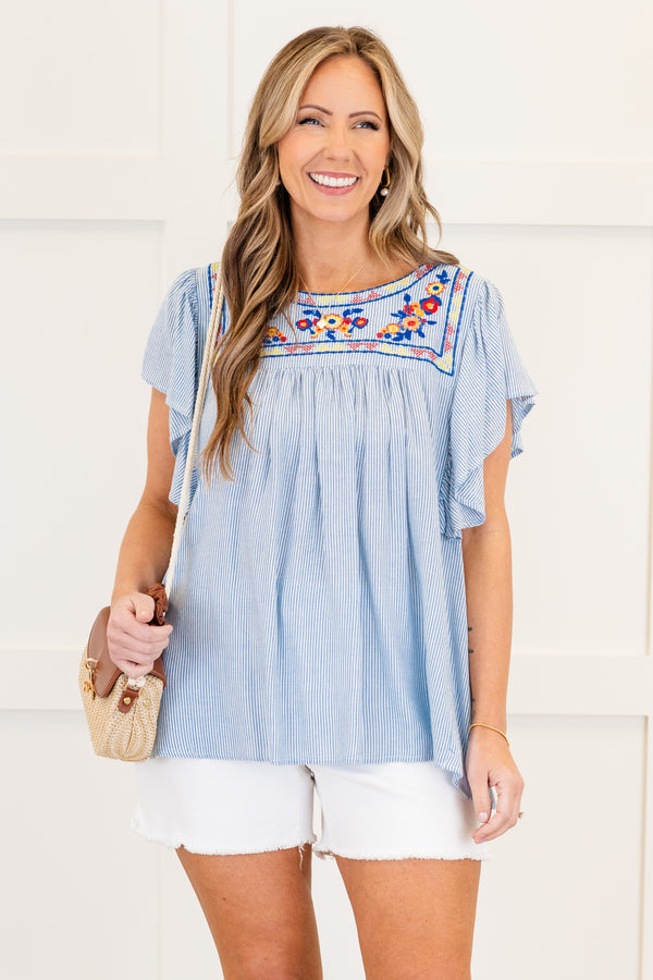 Chic Soul plus size clothing, short-flutter-sleeve denim blue flowy top with a high-scoop-neckline and a multi-colored embroidered floral pattern along the neckline 