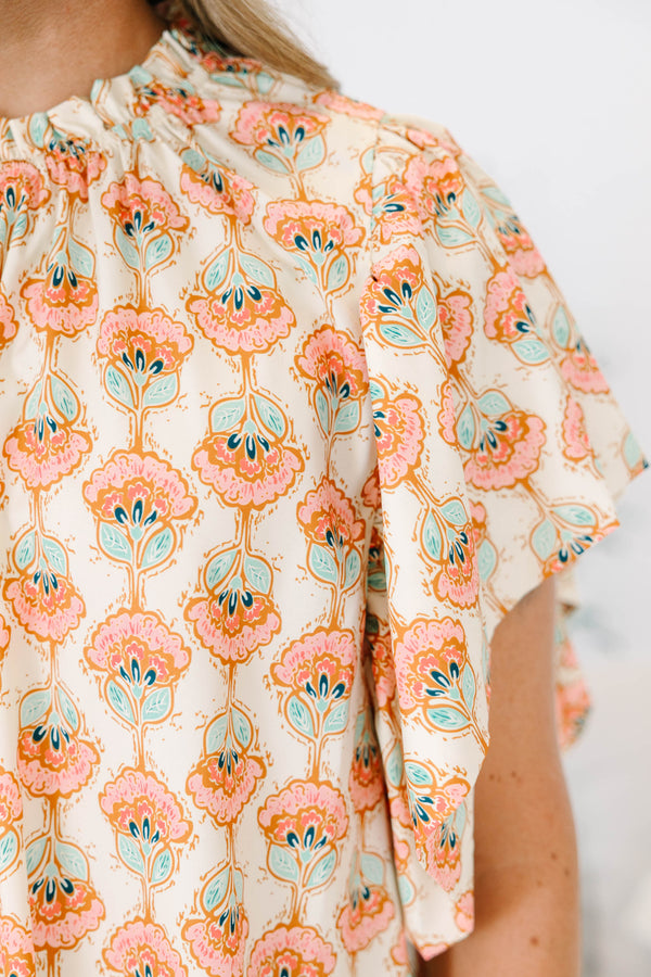 Chic Soul plus size clothing, ivory short sleeve top with light pink/teal paisley design with mock neck with ruffle sleeves