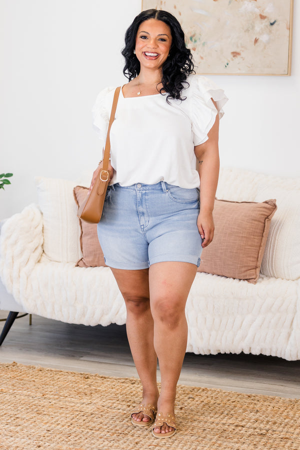 Chic Soul Plus size clothing, light wash jean shorts with front and back pockets as well as cuffs at the end of each short leg 
