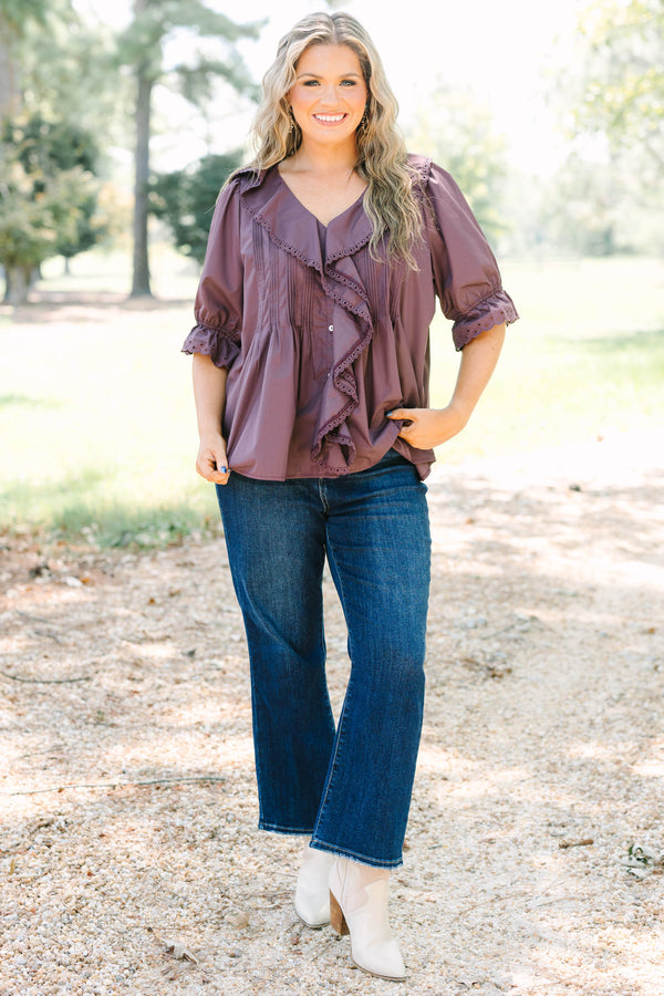 Plus Size brown top with ruffled V-neckline, eyelet trim, button front, and pleated bodice details.