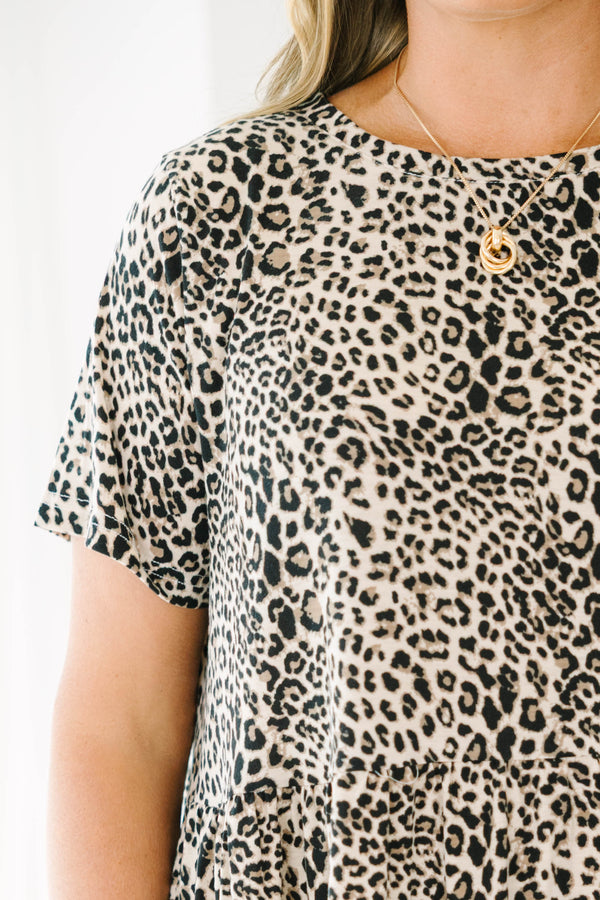 Plus Size leopard print tiered mini dress with short sleeves and a round neckline.