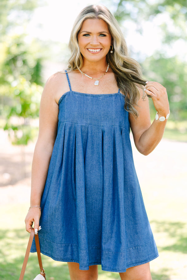 Plus Size denim mini dress with thin spaghetti straps, a square neckline, and a pleated skirt.