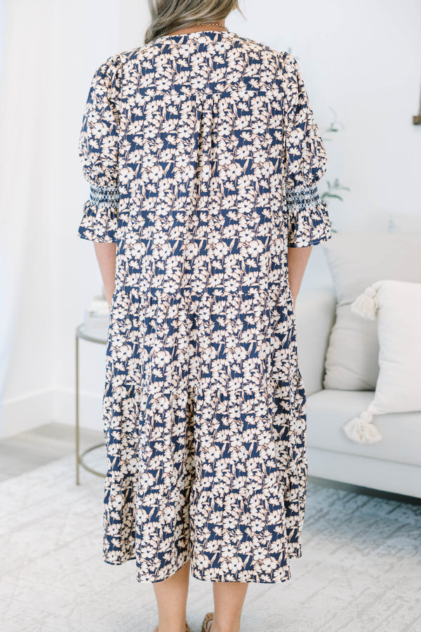 Plus Size black floral tiered midi dress with a V-neckline and three-quarter length puff sleeves.