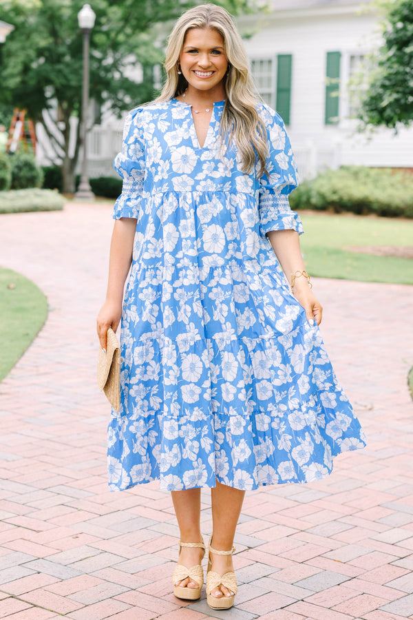 Plus Size blue and white floral tiered midi dress with puff sleeves and a V-neckline.