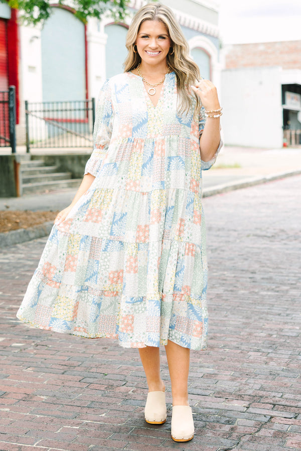 Plus size multi-color patchwork print midi dress with a flowy tiered skirt and v-neckline.