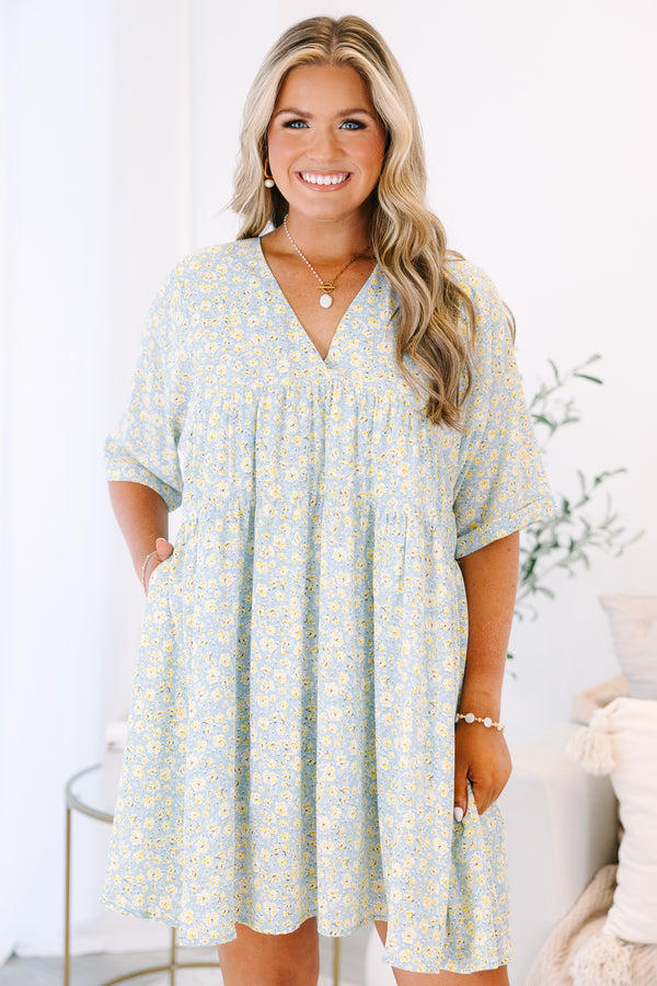 Plus Size light blue babydoll dress with a yellow floral print, V-neckline, and short sleeves.