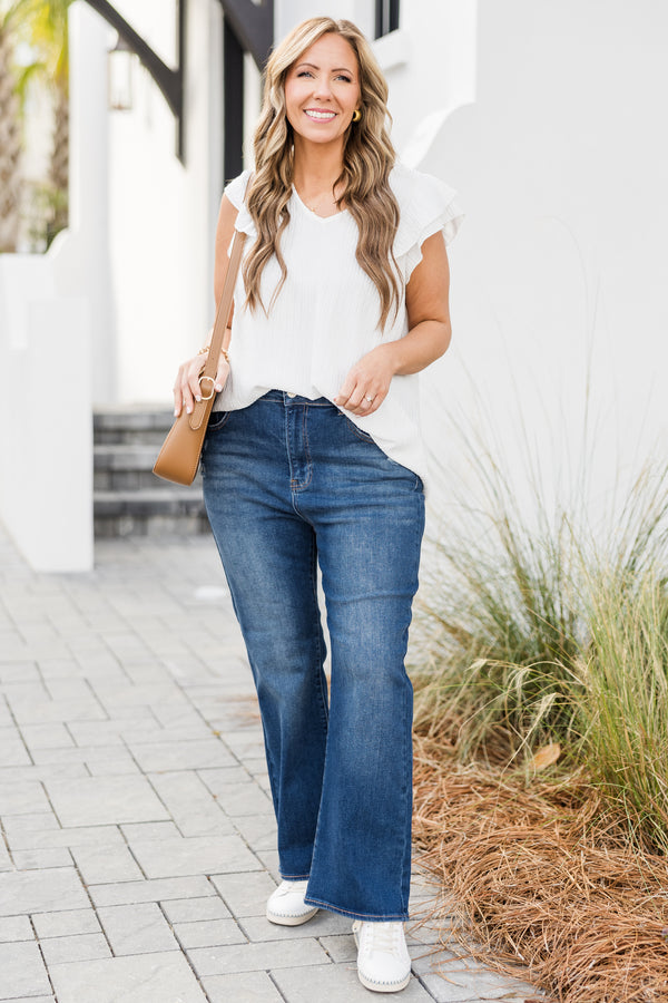 Chic Soul plus size clothing, mid-waisted dark wash straight-leg jeans with silver button detailing