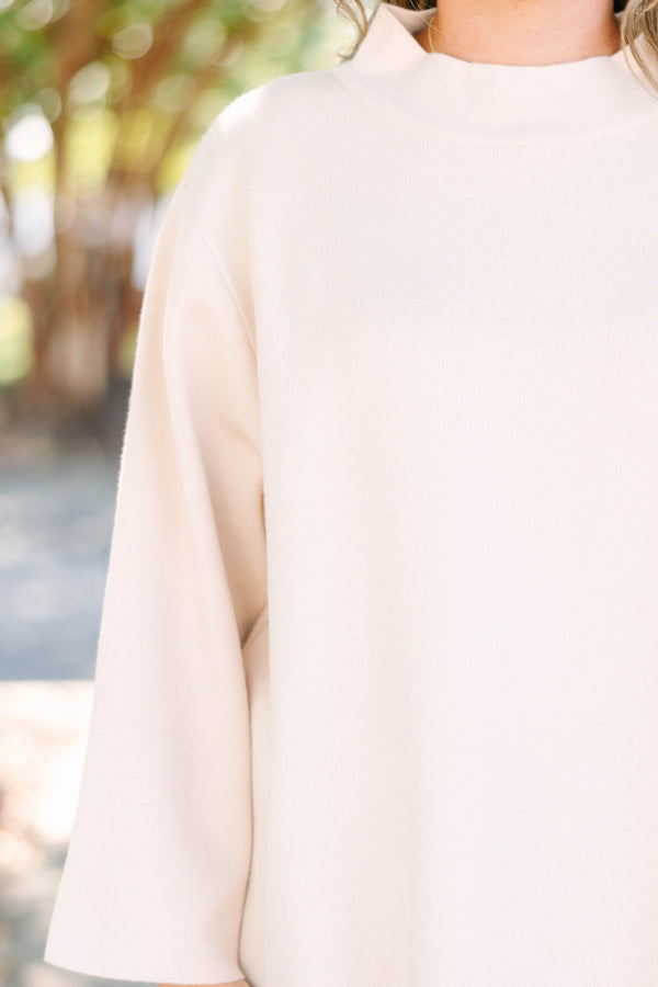 Plus Size taupe mock neck sweater with long wide sleeves and a relaxed fit.