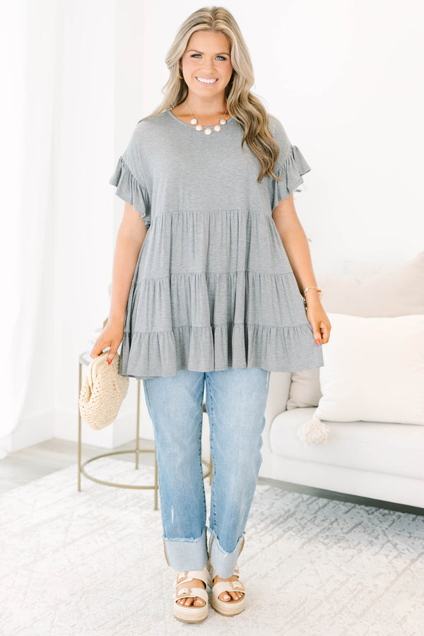 Plus Size charcoal grey tiered tunic with ruffled short sleeves and a flowy, relaxed fit.