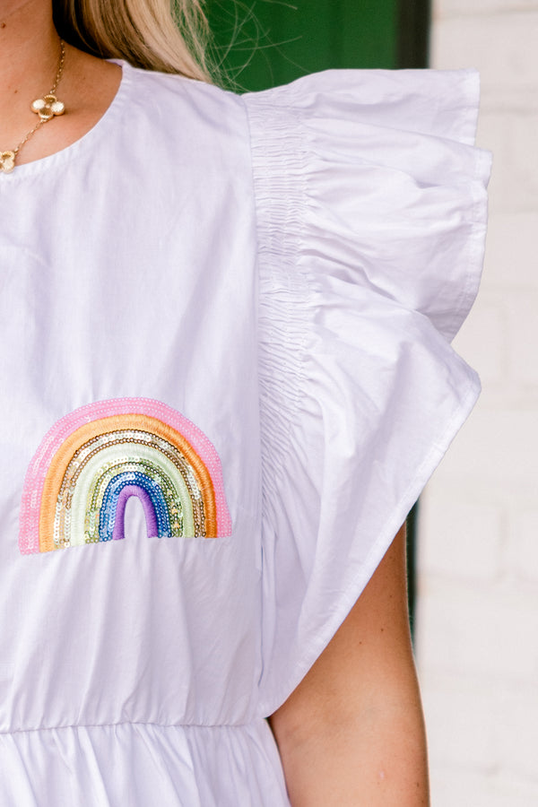 Chic Soul plus size clothing, short-flutter-sleeve white ruffled baby doll dress with a high-scoop-neckline and multi-colored sequined rainbow patches scattered across the dress with gold accents