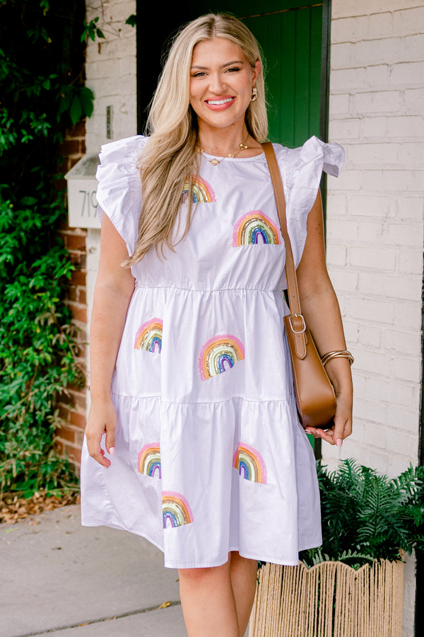 Chic Soul plus size clothing, short-flutter-sleeve white ruffled baby doll dress with a high-scoop-neckline and multi-colored sequined rainbow patches scattered across the dress with gold accents