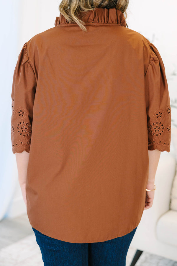 Plus Size brown short sleeve top with eyelet embroidery on the sleeves and a button-up neckline.
