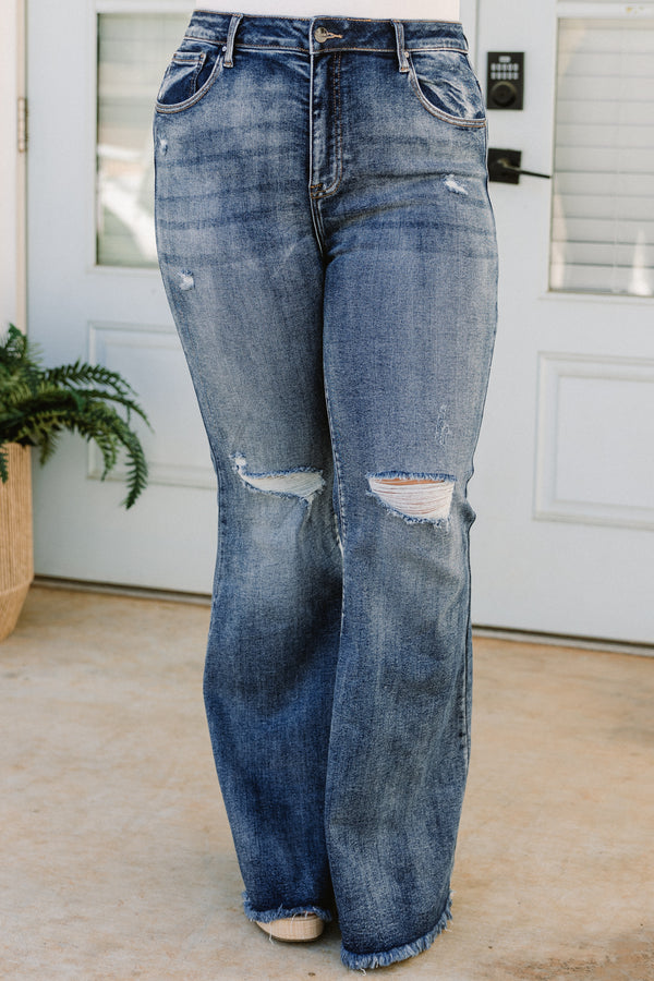 Chic Soul plus size clothing, high-waisted dark wash bootcut denim blue jeans with a subtle distress on the knees and fraying along the seams