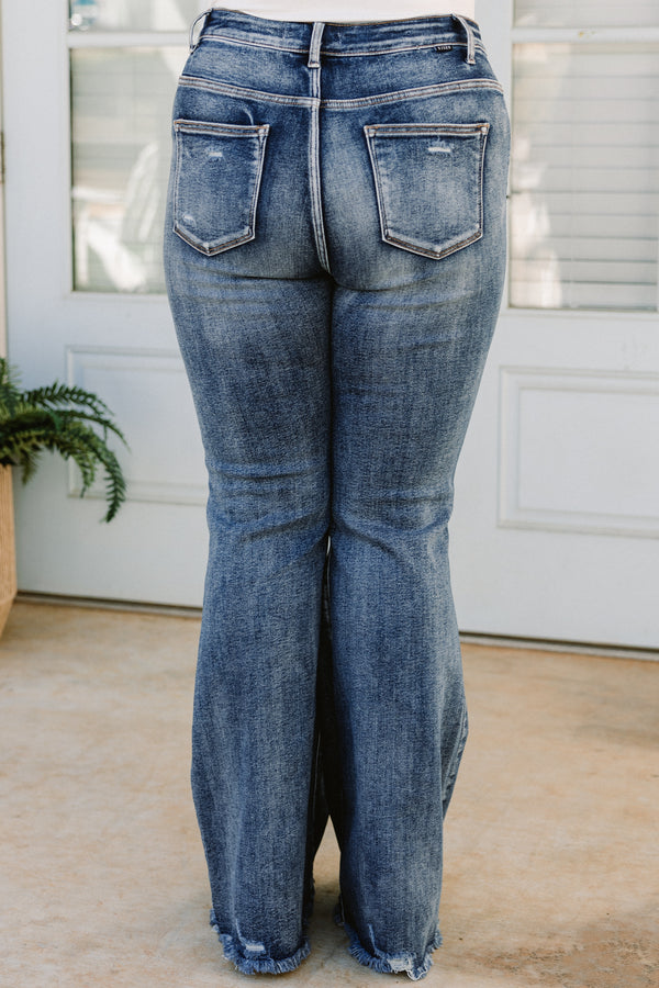 Chic Soul plus size clothing, high-waisted dark wash bootcut denim blue jeans with a subtle distress on the knees and fraying along the seams