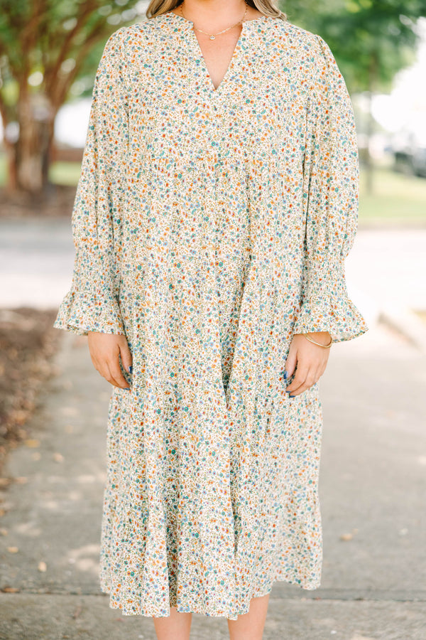 Plus Size cream floral midi dress with a ditsy print, split v-neck, and smocked cuff sleeves.