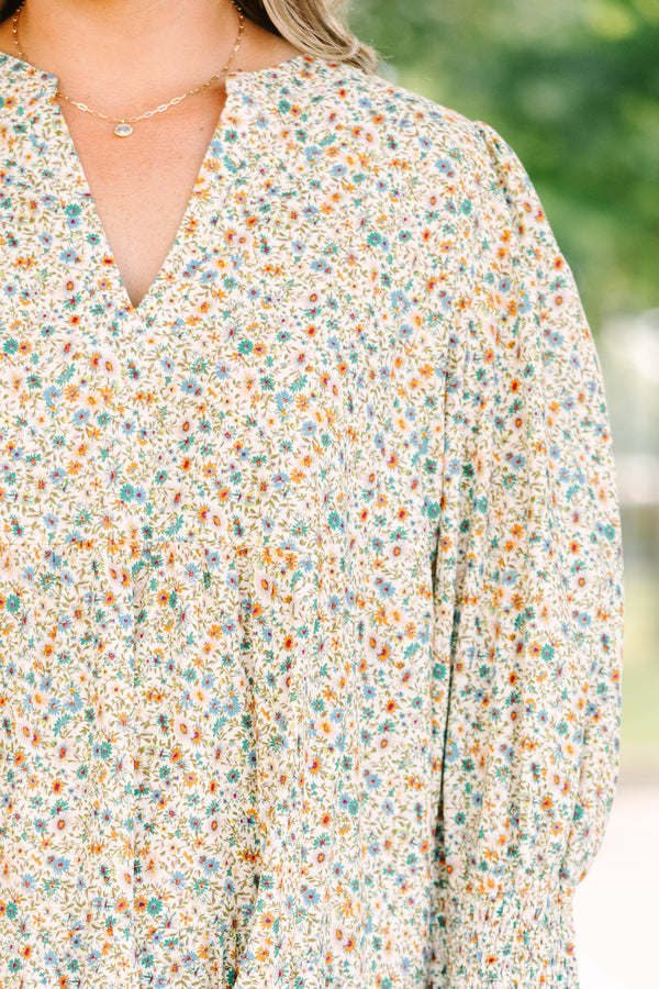 Plus Size cream floral midi dress with a ditsy print, split v-neck, and smocked cuff sleeves.
